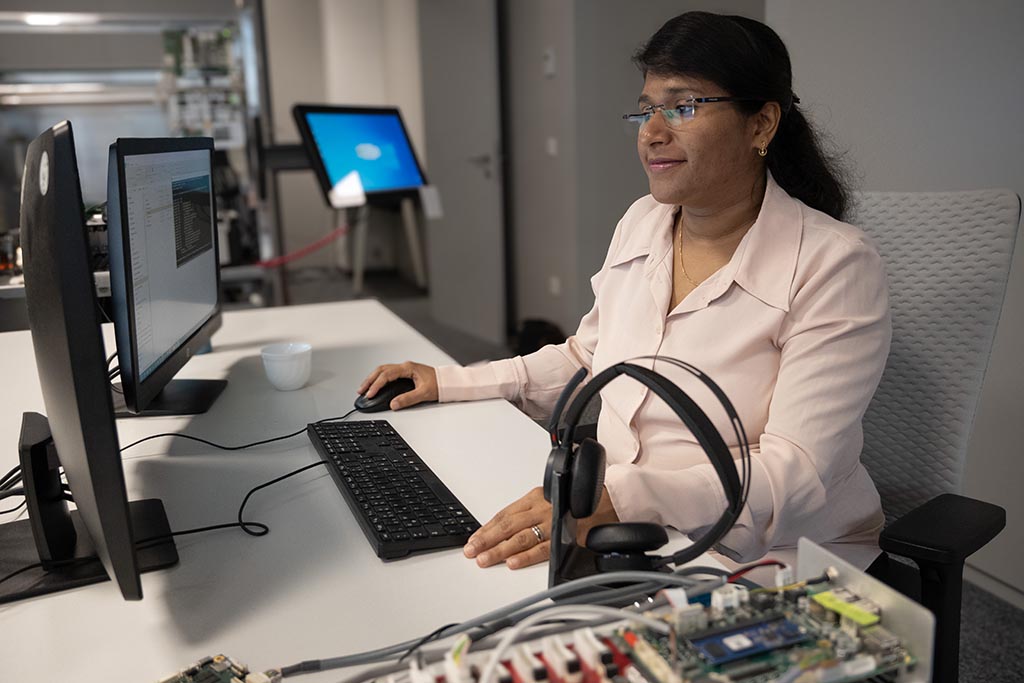Grace Mary from STRATEC working at the two monitors in front of her 