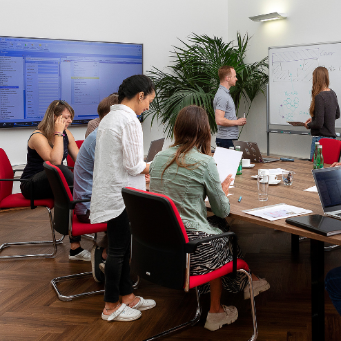 STRATEC employees during a meeting in a big meeting room in Austria STRATEC employees during a meeting in a big meeting room in Austria