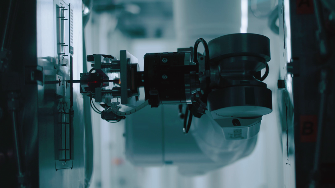 A robotic arm operating in a laboratory setting at STRATEC A robotic arm operating in a laboratory setting at STRATEC
