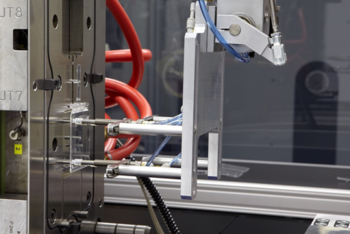 Detailed shot of the interior of a machine for the manufacturing of consumables at STRATEC