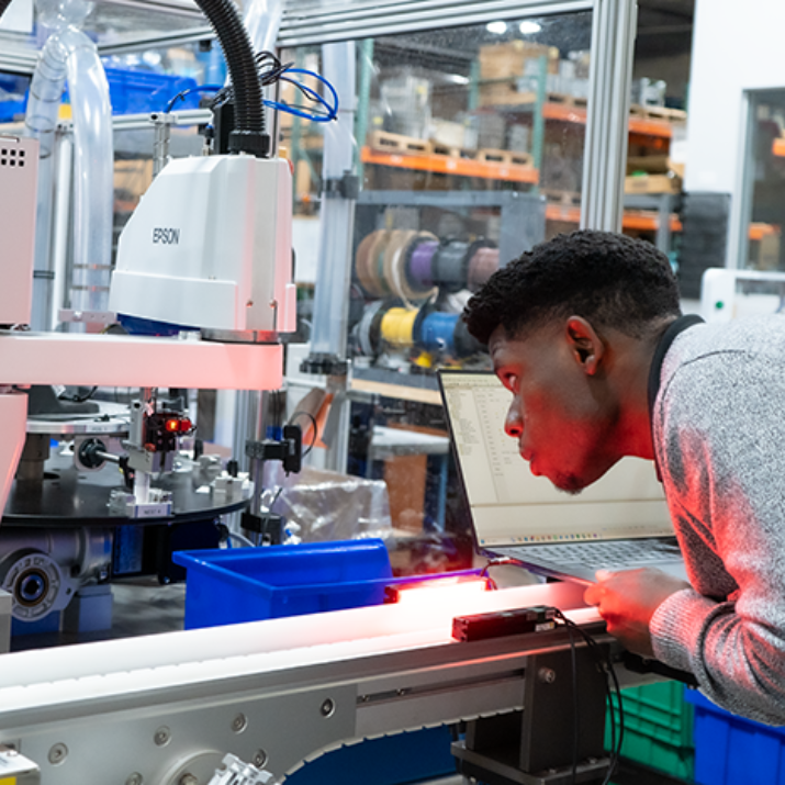 Employee inspecting the functionality of a system from close-up Employee inspecting the functionality of a system from close-up