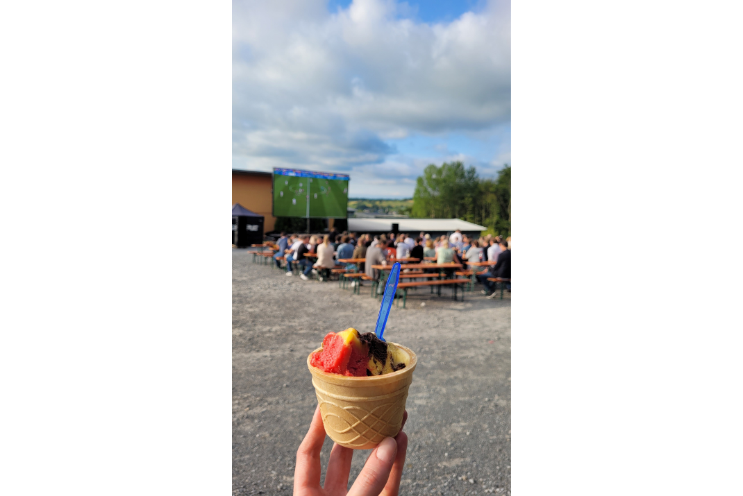 Picture by a STRATEC employee in Birkenfeld, Germany of an ice-cream with employees watching the Germany-Hungary football match in the back